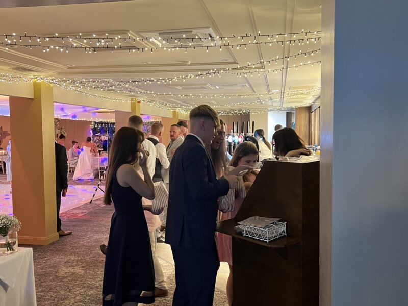 Wedding Treatcycle at Abbey House Hotel Wedding guests choosing sweets from the Photohoof Treatcycle at Abbey House Hotel