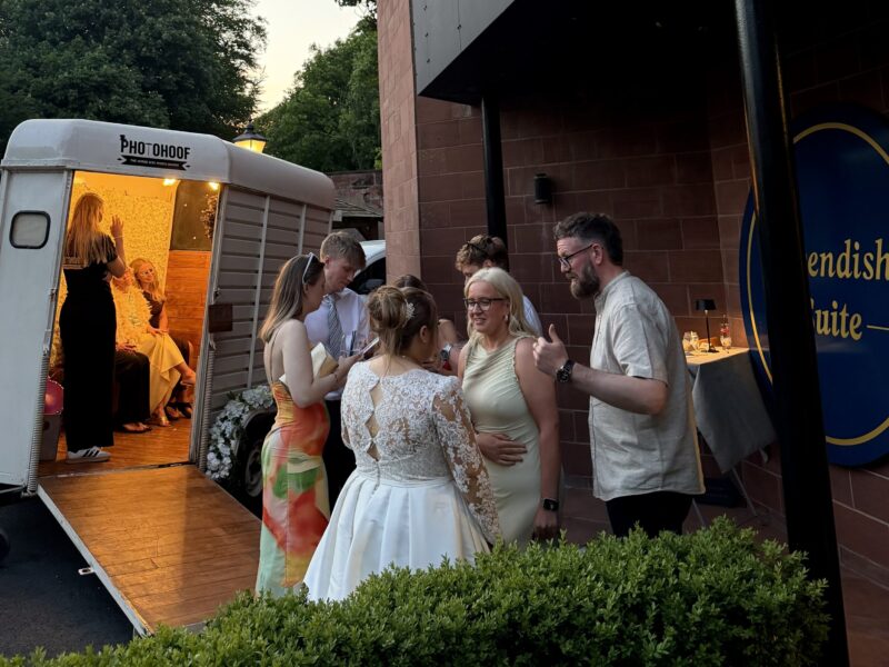 Wedding Horse Box Photo Booth at Abbey House Hotel Wedding guests enjoying the Photohoof horse box photo booth outside the Cavendish Suite at Abbey House Hotel
